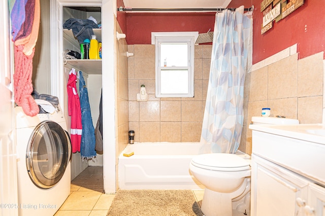 full bathroom featuring vanity, shower / bath combo with shower curtain, tile patterned flooring, washer / clothes dryer, and toilet