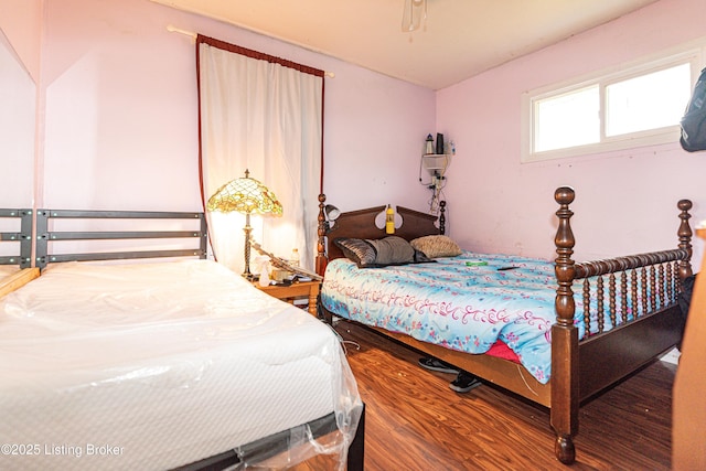 bedroom with hardwood / wood-style flooring