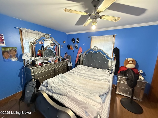 bedroom featuring ceiling fan and crown molding