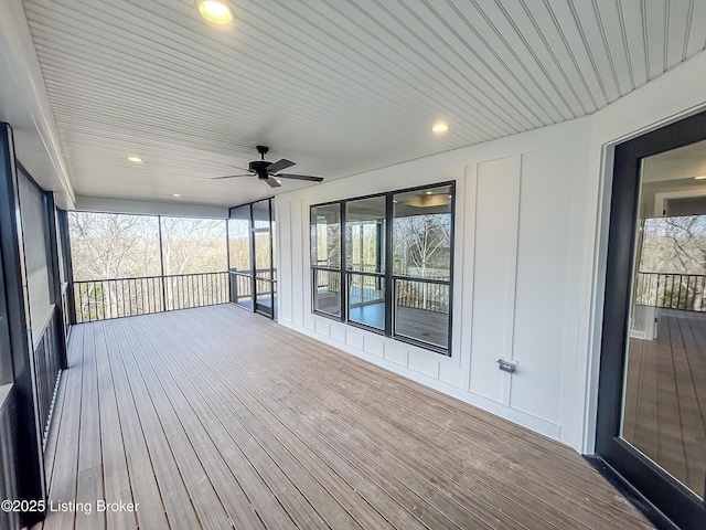 deck featuring ceiling fan and a porch