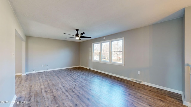 unfurnished room with ceiling fan and hardwood / wood-style floors