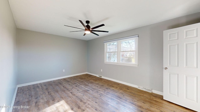 empty room with ceiling fan and light wood-type flooring