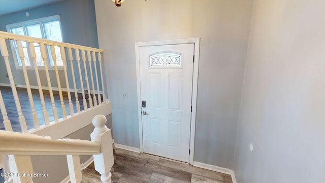 foyer entrance with hardwood / wood-style floors