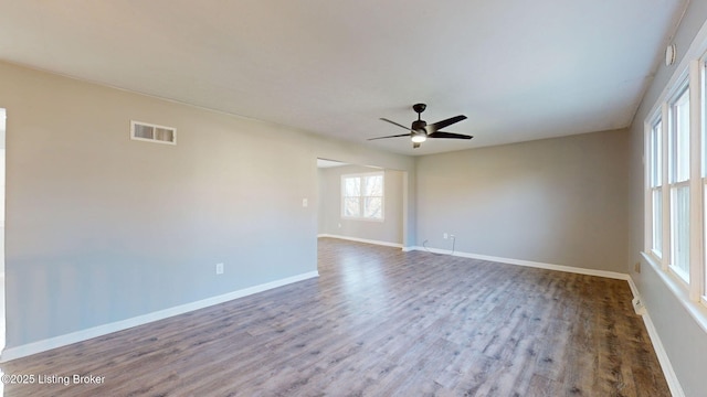 spare room with hardwood / wood-style floors and ceiling fan