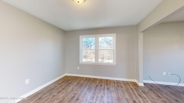 spare room featuring hardwood / wood-style floors