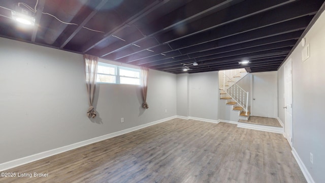 basement featuring wood-type flooring