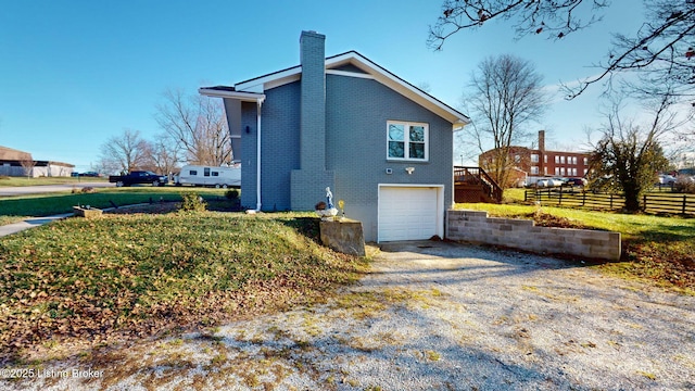 view of side of property with a garage