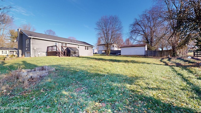 view of yard featuring a wooden deck