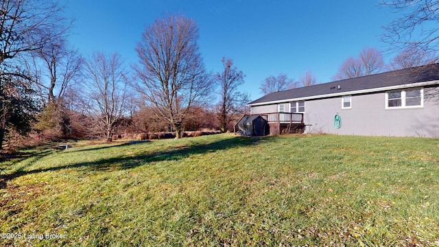 view of yard with a wooden deck