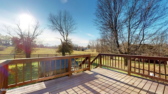 wooden deck with a rural view