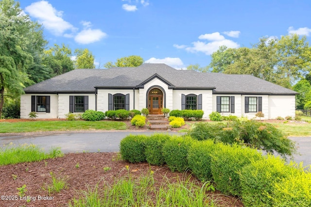 view of front of home featuring a shingled roof