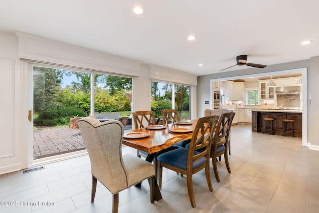 dining area featuring recessed lighting, visible vents, and light tile patterned floors