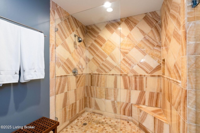 full bath featuring tiled shower