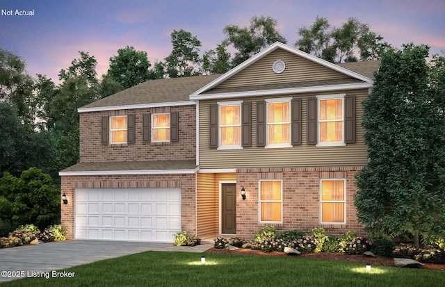 view of front of property featuring a yard and a garage