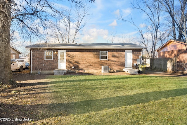 back of house with a yard