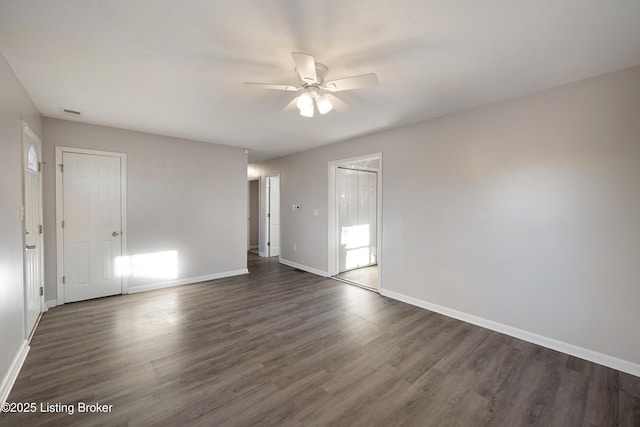 unfurnished room featuring ceiling fan and dark hardwood / wood-style floors