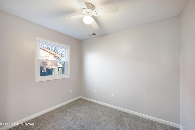 empty room with carpet flooring and ceiling fan