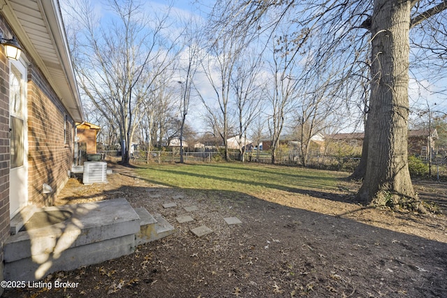 view of yard with central air condition unit