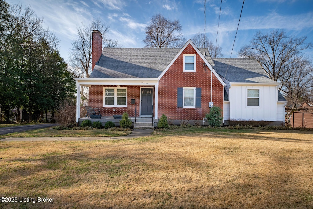 view of front of home with a porch and a front yard