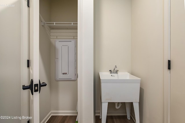 washroom with dark hardwood / wood-style flooring