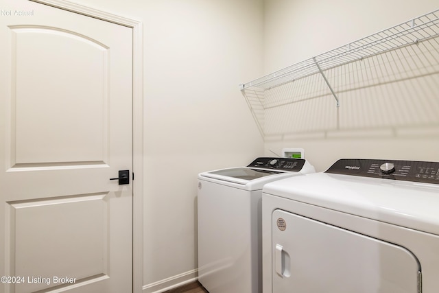 washroom with washer and dryer