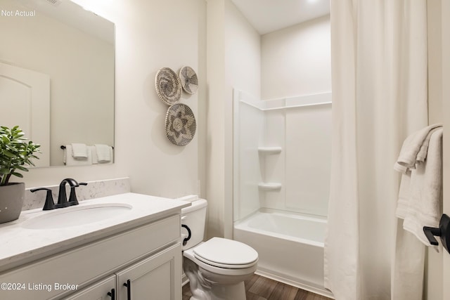 full bathroom with hardwood / wood-style flooring, vanity, toilet, and shower / bathtub combination with curtain