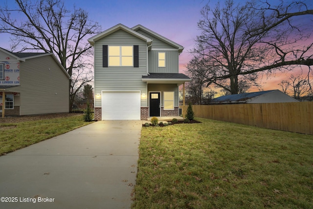 front facade with a yard and a garage