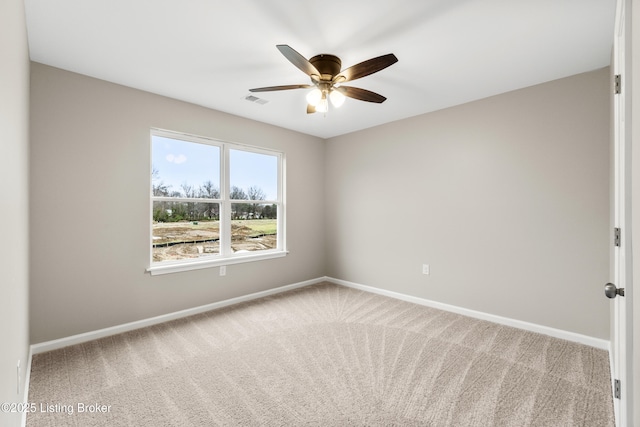 carpeted empty room with ceiling fan