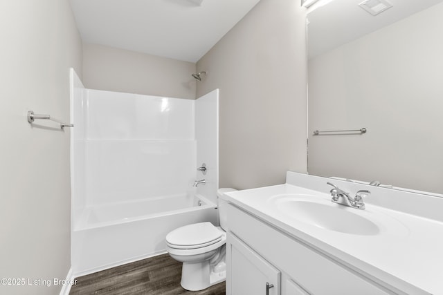 full bathroom with shower / bathing tub combination, vanity, toilet, and wood-type flooring