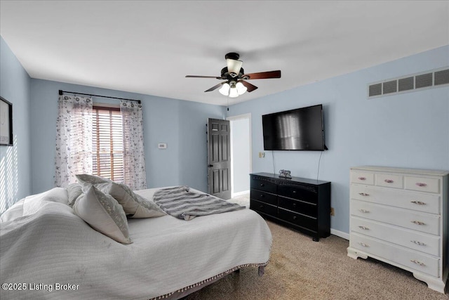 bedroom with ceiling fan and light colored carpet