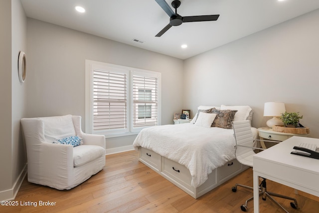 bedroom featuring light hardwood / wood-style floors and ceiling fan