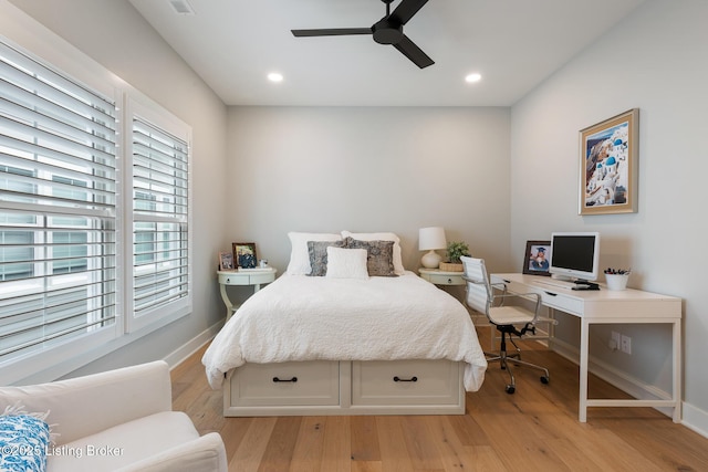 bedroom with light hardwood / wood-style floors and ceiling fan