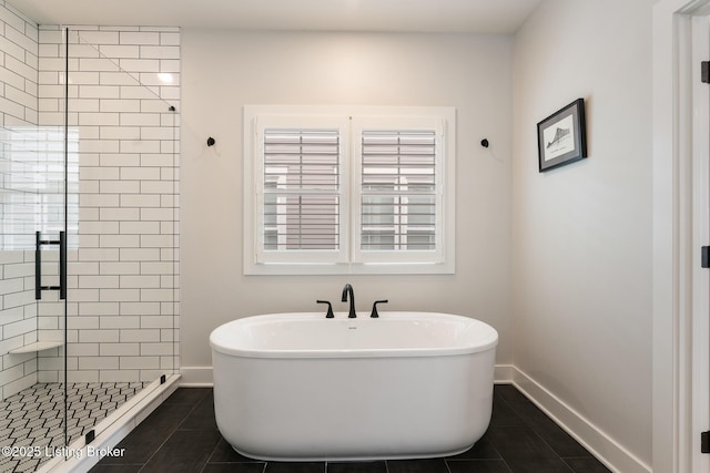 bathroom with tile patterned floors and independent shower and bath