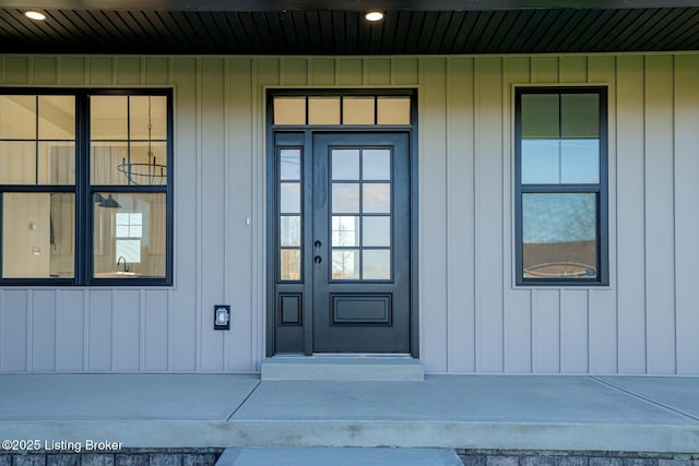 view of exterior entry featuring a porch