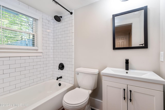 full bathroom with vanity, toilet, and tiled shower / bath