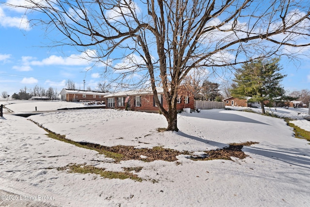 view of yard layered in snow