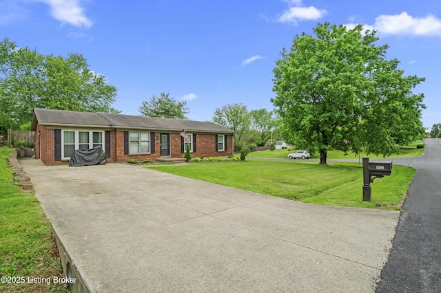 102 Eastland Dr, Bardstown, KY 40004 - view of front of property featuring driveway, brick siding, and a front lawn