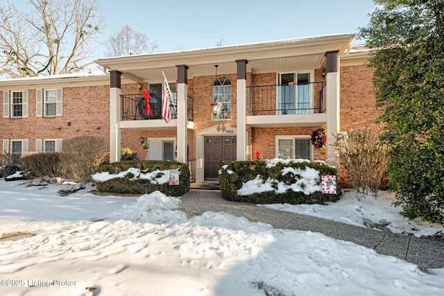 view of front of home with a balcony