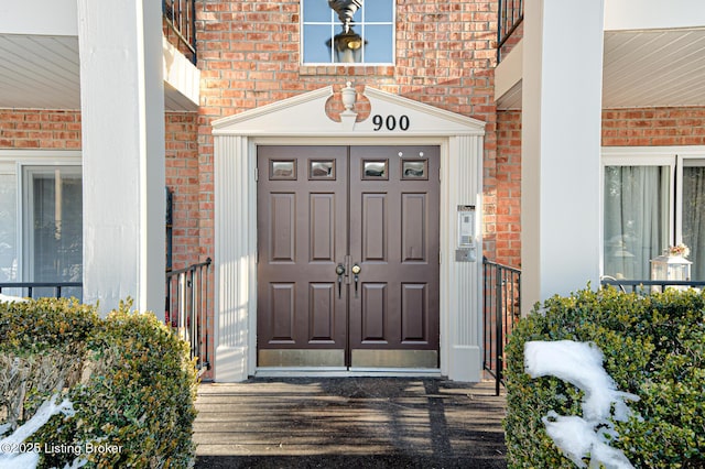 view of exterior entry with a porch