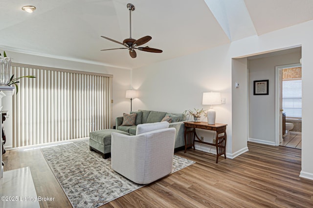 living room with ceiling fan and wood-type flooring