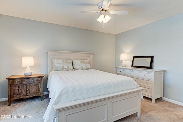 bedroom featuring ceiling fan and light carpet