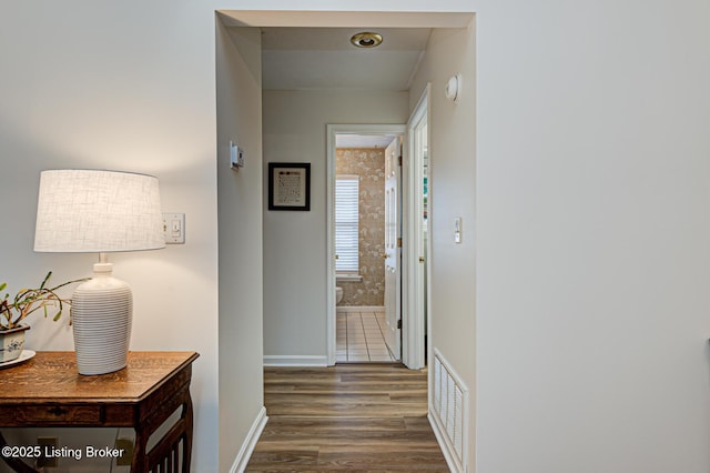 corridor with dark wood-type flooring