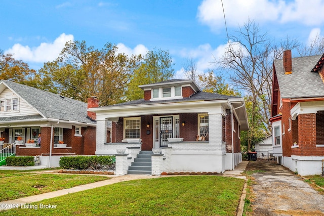 bungalow-style house featuring a front yard and a porch