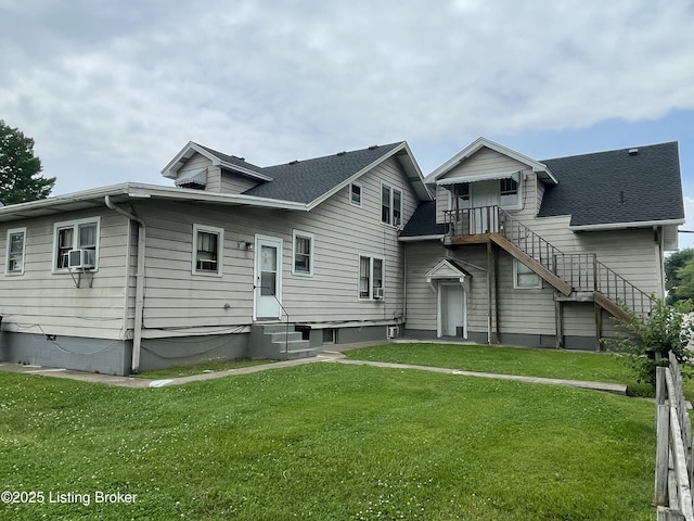 view of front of home with a front yard and cooling unit