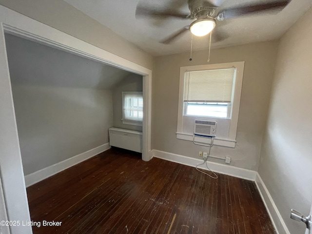 bonus room featuring dark hardwood / wood-style flooring, cooling unit, and ceiling fan