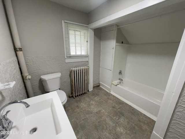 full bathroom featuring shower / bathtub combination, radiator, sink, tile walls, and toilet