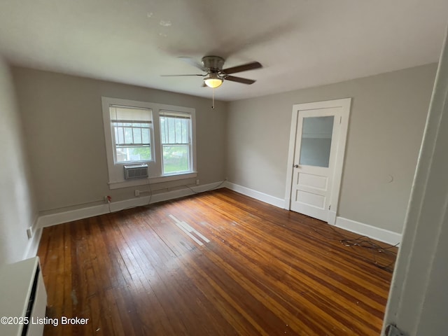 empty room featuring wood-type flooring and ceiling fan