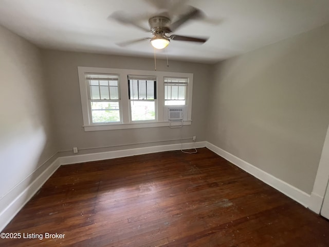 empty room with dark hardwood / wood-style floors, ceiling fan, and cooling unit