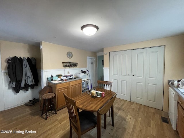 dining space with light hardwood / wood-style floors