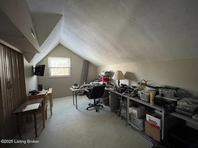 office featuring a textured ceiling and lofted ceiling